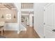 Bright foyer with hardwood floors, wainscoting, staircase, and view into the living spaces at 19 Mediterranean Ave # 506, Sharpsburg, GA 30277