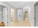 Hallway with multiple doorways leading to various rooms at 19 Mediterranean Ave # 506, Sharpsburg, GA 30277