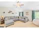 Large living room features a ceiling fan, comfortable sectional sofa and a large bean bag at 19 Mediterranean Ave # 506, Sharpsburg, GA 30277