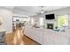 Inviting living room with fireplace, hardwood floors, open concept to kitchen, and ample natural light at 19 Mediterranean Ave # 506, Sharpsburg, GA 30277