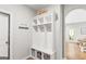 Organized mudroom area with built-in storage cubbies, hooks, and baskets for tidy storage at 19 Mediterranean Ave # 506, Sharpsburg, GA 30277