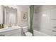 Clean bathroom with a shower-tub combo, stylish vanity, and modern finishes at 604 Parnassus Rd # 05, Locust Grove, GA 30248