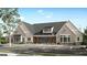 Community center with a gray roof, parking, and landscaping at 604 Parnassus Rd # 05, Locust Grove, GA 30248