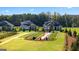 Community green space with walking paths, trees, and manicured lawns at 604 Parnassus Rd # 05, Locust Grove, GA 30248