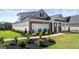 Beautiful home featuring brick, manicured lawn, and 2-car garage at 604 Parnassus Rd # 05, Locust Grove, GA 30248