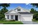 Charming, single story home featuring white brick, black door, and manicured lawn at 604 Parnassus Rd # 05, Locust Grove, GA 30248