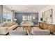 Open living room with comfortable seating, modern decor, and large windows offering ample natural light at 604 Parnassus Rd # 05, Locust Grove, GA 30248