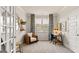 Bright home office with stylish furniture, a large window, and a functional layout for a productive work environment at 604 Parnassus Rd # 05, Locust Grove, GA 30248