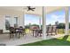 Covered patio area with a ceiling fan, outdoor furniture, and ample space for dining and lounging at 604 Parnassus Rd # 05, Locust Grove, GA 30248