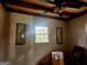 Sunlit bedroom featuring neutral walls, a bright window, and classic framed floral prints at 309 Cornish Mountain Rd, Covington, GA 30014