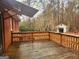 Wet wooden deck off of brick house, outbuilding in background at 309 Cornish Mountain Rd, Covington, GA 30014