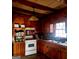 The kitchen has beautiful wood cabinets, ample storage and lots of natural light at 309 Cornish Mountain Rd, Covington, GA 30014