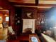 Cozy living room with a red brick fireplace and wood paneling at 309 Cornish Mountain Rd, Covington, GA 30014