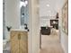 Charming bathroom leads into an open floor plan with an island kitchen and fireplace at 400 Walnut Grove Rd, Peachtree City, GA 30269