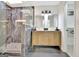 Modern bathroom featuring a tiled shower with glass door, double vanity, and walk in closet at 400 Walnut Grove Rd, Peachtree City, GA 30269