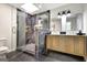 Luxurious bathroom featuring a glass enclosed shower with marble-like tile, and double vanity at 400 Walnut Grove Rd, Peachtree City, GA 30269