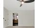 Bedroom featuring neutral carpet, ceiling fan, door to bathroom, and natural light streaming through windows at 400 Walnut Grove Rd, Peachtree City, GA 30269