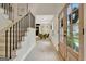 Bright foyer showcasing stairs and an open layout leading to the dining area and front entrance at 400 Walnut Grove Rd, Peachtree City, GA 30269