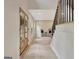 Inviting foyer with double front doors, light hardwood floors, and a staircase with black metal spindles at 400 Walnut Grove Rd, Peachtree City, GA 30269