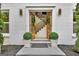 Elegant foyer with double doors, interior staircase, and sophisticated decor at 400 Walnut Grove Rd, Peachtree City, GA 30269