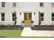 Beautiful entrance featuring double doors, greenary, and tasteful plantings at 400 Walnut Grove Rd, Peachtree City, GA 30269