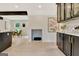 Modern kitchen featuring black cabinets, marble countertops, stainless steel appliances, and an open floor plan at 400 Walnut Grove Rd, Peachtree City, GA 30269