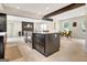 Kitchen island with stainless oven and view of open concept living and dining areas at 400 Walnut Grove Rd, Peachtree City, GA 30269