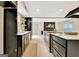 Modern kitchen featuring stainless appliances, white countertops, custom cabinets and view of living spaces at 400 Walnut Grove Rd, Peachtree City, GA 30269