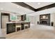 Open-concept kitchen with a center island, modern cabinets, and a fireplace in the adjoining living area at 400 Walnut Grove Rd, Peachtree City, GA 30269