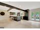 Open concept kitchen with island, stainless appliances, custom cabinets and view of backyard from rear door at 400 Walnut Grove Rd, Peachtree City, GA 30269