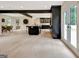 Spacious living room with hardwood floors, an open floor plan, and a view of the kitchen and dining area at 400 Walnut Grove Rd, Peachtree City, GA 30269
