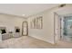 Bright living room with hardwood floors and minimalist decor including two chairs and modern artwork at 400 Walnut Grove Rd, Peachtree City, GA 30269