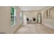 Bright living room with hardwood floors, two windows, and two chairs with decorative pillows at 400 Walnut Grove Rd, Peachtree City, GA 30269