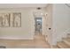 Hardwood floors with decor artwork on the wall and a partial view of a modern bathroom at 400 Walnut Grove Rd, Peachtree City, GA 30269