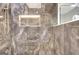 Modern glass shower with marble-look tile, rainfall shower head, and recessed shelf at 400 Walnut Grove Rd, Peachtree City, GA 30269