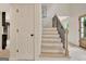 Staircase with wood treads, black iron spindles, and a light wood handrail at 400 Walnut Grove Rd, Peachtree City, GA 30269