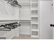 Walk-in closet with built-in shelving and hanging racks at 400 Walnut Grove Rd, Peachtree City, GA 30269