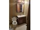 Bathroom featuring a toilet, vanity sink, mirror, and overhead lighting at 4298 Brookside Dr, Forest Park, GA 30297