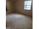 Bedroom with paneled walls and window for natural light at 4298 Brookside Dr, Forest Park, GA 30297