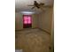 Bedroom with paneled walls, ceiling fan, and window for natural light at 4298 Brookside Dr, Forest Park, GA 30297