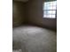 Bedroom with paneled walls and window for natural light at 4298 Brookside Dr, Forest Park, GA 30297