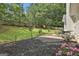 Spacious backyard featuring a patio, lush grass, and a beautifully landscaped area at 215 Murphy Creek Ln, Fayetteville, GA 30215