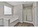 Bathroom featuring a bathtub and glass shower at 215 Murphy Creek Ln, Fayetteville, GA 30215
