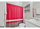Full bathroom featuring neutral tones, vanity, toilet, and shower with bright red curtain at 215 Murphy Creek Ln, Fayetteville, GA 30215
