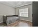 This bedroom provides wood flooring and natural light at 215 Murphy Creek Ln, Fayetteville, GA 30215