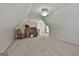 Bright bonus room with carpet, ceiling fan, and classic wood desk and chair at 215 Murphy Creek Ln, Fayetteville, GA 30215