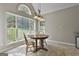 Bright breakfast nook with large windows and a cozy table setting, perfect for morning coffee at 215 Murphy Creek Ln, Fayetteville, GA 30215