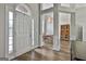 Bright foyer with wood floors leading to dining area and a large arched window at 215 Murphy Creek Ln, Fayetteville, GA 30215