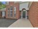 Inviting front entrance with a black door, a wreath, and arched windows at 215 Murphy Creek Ln, Fayetteville, GA 30215