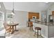 Eat-in kitchen boasts granite countertops, bar seating, and natural light, ideal for casual dining at 215 Murphy Creek Ln, Fayetteville, GA 30215